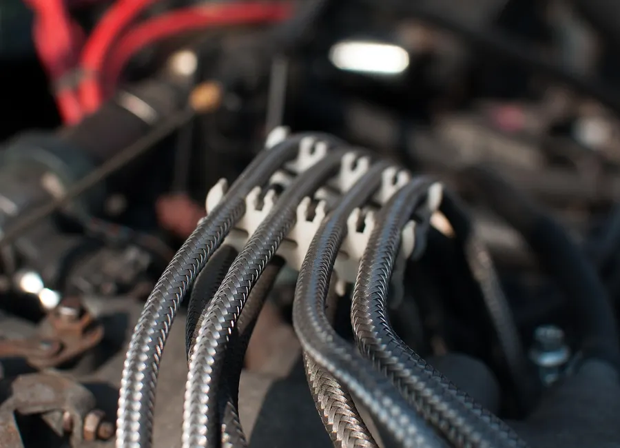 Braided sleeve wire looms in a car engine bay