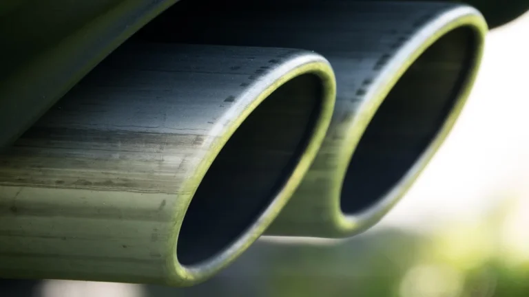 Close-up of twin chrome exhaust tips on a car
