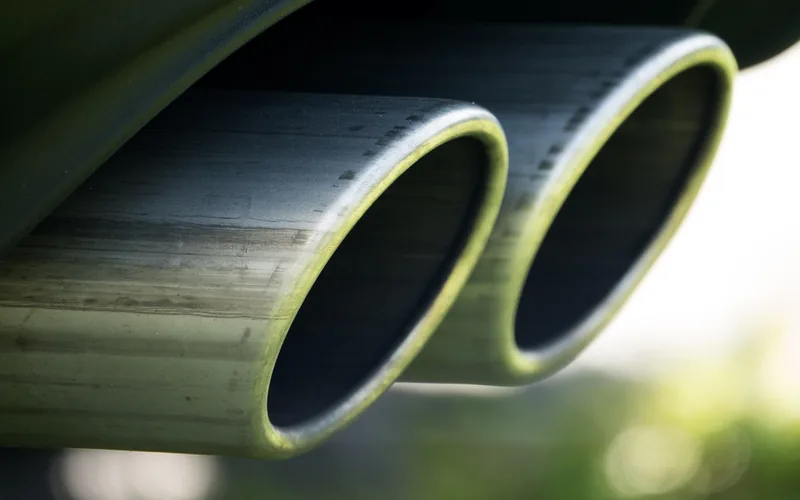 Dual cat-back performance exhaust system installed underneath a car