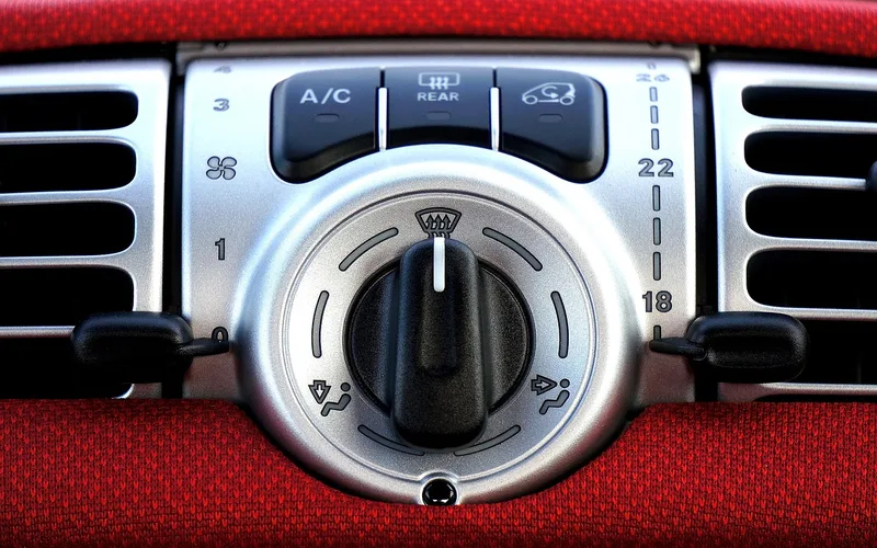 Ford A/C dashboard vents Car dashboard air conditioning vents and climate control panel related to a Ford P1464 A/C demand code