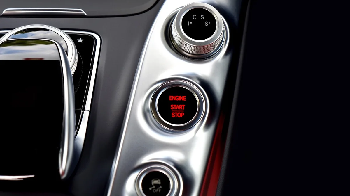Car dashboard with start-stop indicator light