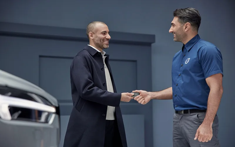 A service advisor discussing repair options with a customer at a dealership