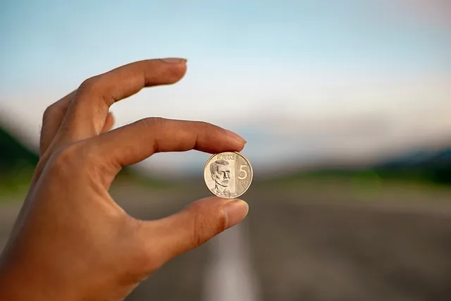Hand holding cash to give as a tip