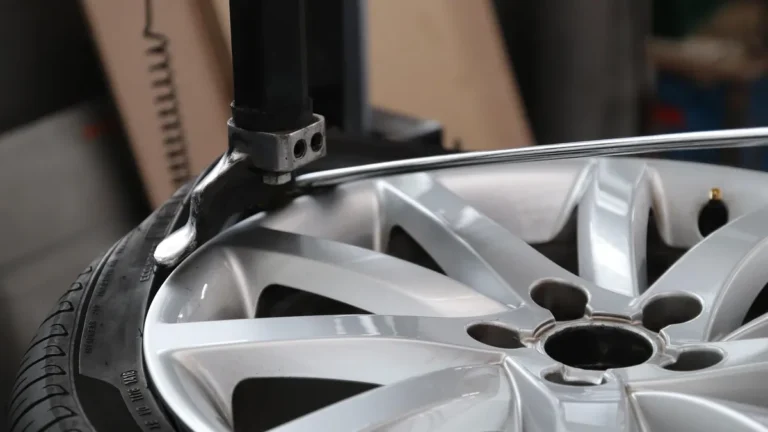 Tire being mounted on a wheel rim on a tire changing machine