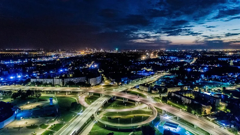 Aerial view of a city and its road network lit at night Aerial view of a city and its road network lit at night