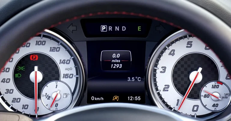 Car instrument cluster with speedometer and odometer readout in miles