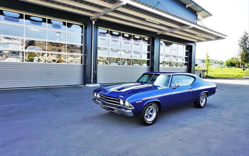 Dark Chevrolet Chevelle SS muscle car with big-block V8 badging Dark Chevrolet Chevelle SS muscle car with big-block V8 badging