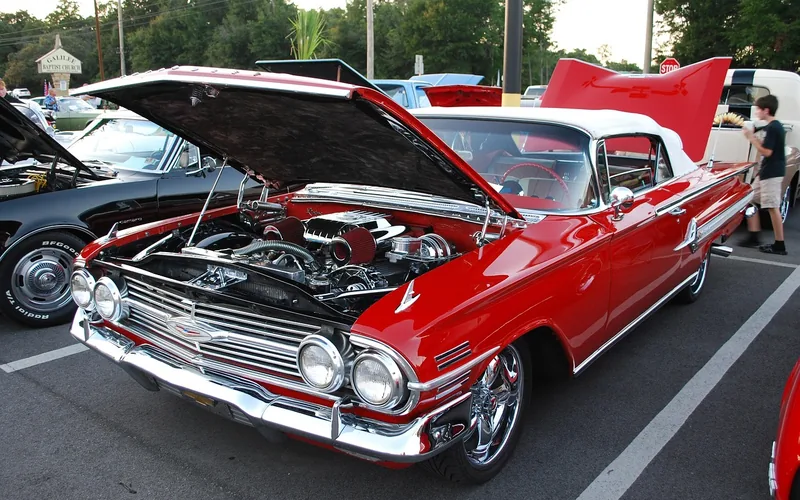 Restored red 1960 Chevrolet Impala, a top-selling full-size car of the model year Restored red 1960 Chevrolet Impala, a top-selling full-size car of the model year
