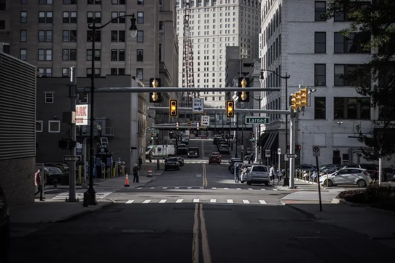 Downtown Detroit street with traffic lights and office buildings