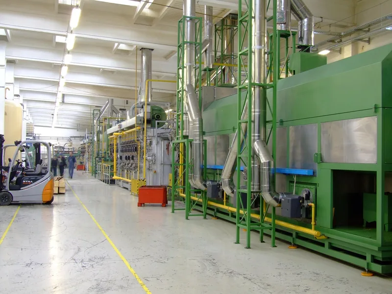 Factory floor with production equipment and a forklift