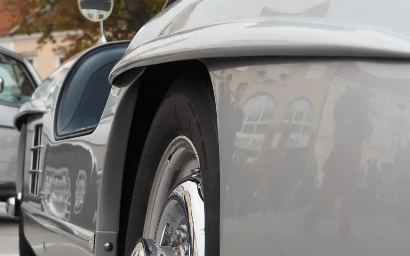 Silver 1954 Mercedes-Benz 300SL Gullwing front fender and wheel with gullwing door open