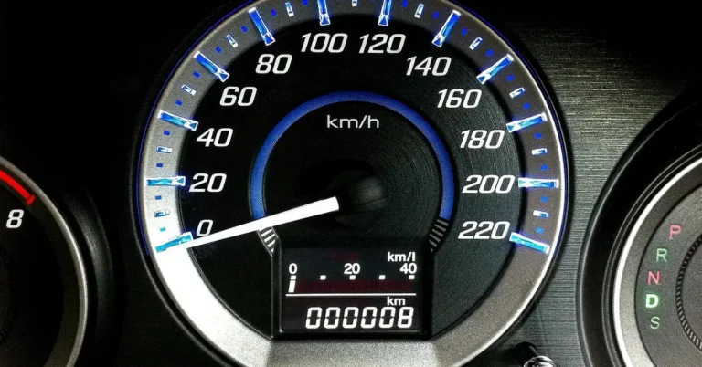 Car instrument cluster with a speedometer and an odometer reading 8 kilometers