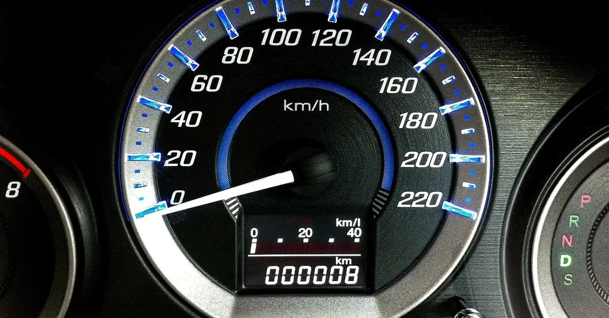 Car instrument cluster with a speedometer and an odometer reading 8 kilometers