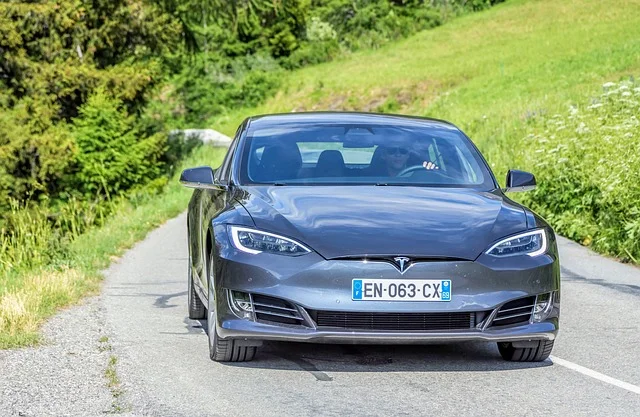 White Tesla Model 3 electric car parked outdoors, representing the company Eberhard, Tarpenning, and Musk built