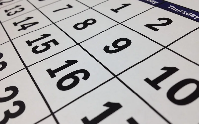 Close-up of a wall calendar showing days of the month