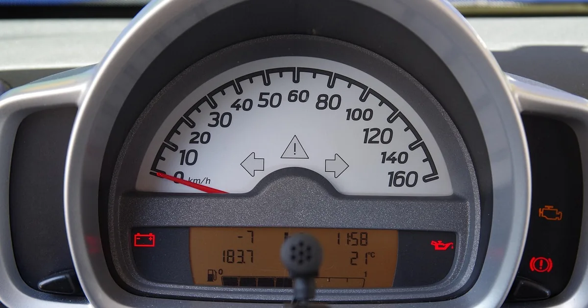 illuminated battery warning light on a car dashboard indicating a possible alternator problem
