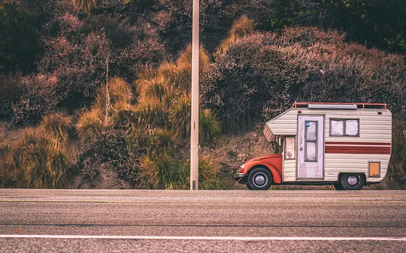 RV motorhome driving on a highway, a common use case for GPS units with custom vehicle routing