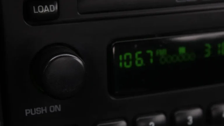 Car radio display tuned to an FM frequency, the input an FM transmitter adapter uses