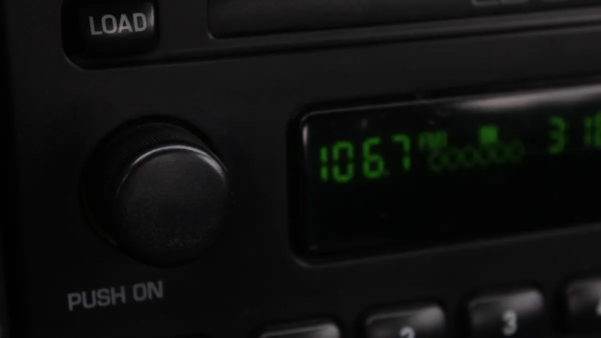 Car radio display tuned to an FM frequency, the input an FM transmitter adapter uses