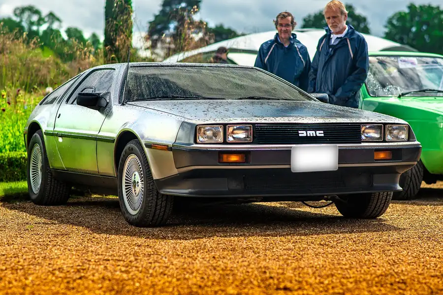 The unpainted brushed stainless steel body of a DeLorean DMC-12 seen from the front