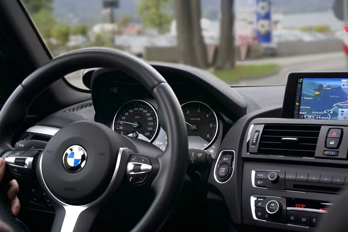 Affordable GPS navigators keep working with no cell signal, unlike a phone GPS navigation device mounted on a car dashboard showing a route