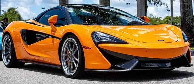 Detail view of a McLaren sports car body and wheel design