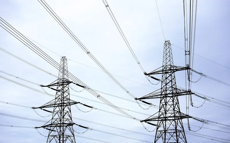 High-voltage power transmission lines carrying electricity from the grid