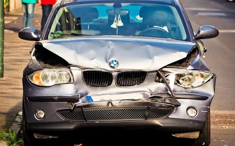 Damaged car after a collision, the kind of accident that becomes a personal financial liability without insurance Damaged car after a collision, the kind of accident that becomes a personal financial liability without insurance
