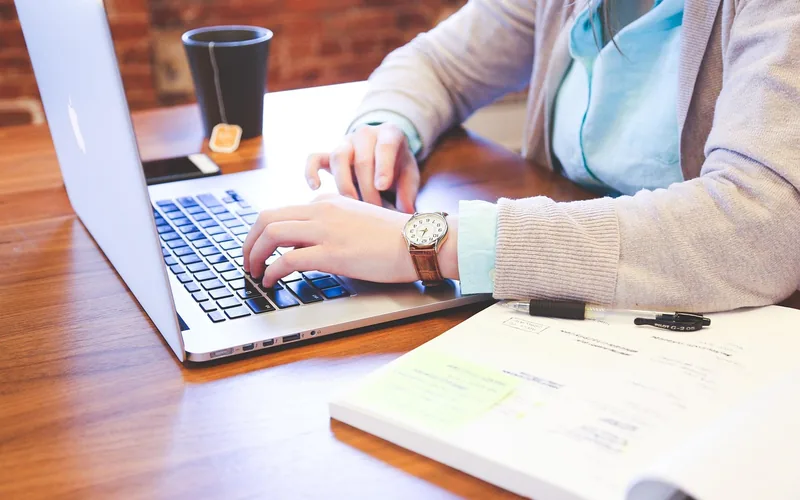 Person comparing car insurance quotes online on a laptop to find affordable legal coverage Person comparing car insurance quotes online on a laptop to find affordable legal coverage