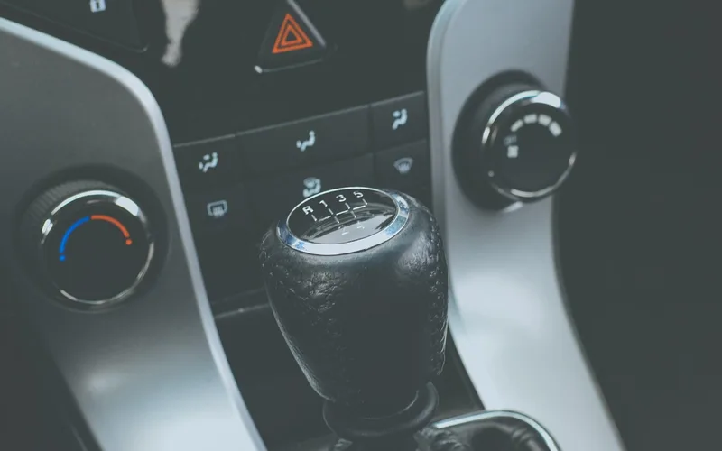 Manual transmission gear shift lever inside a car