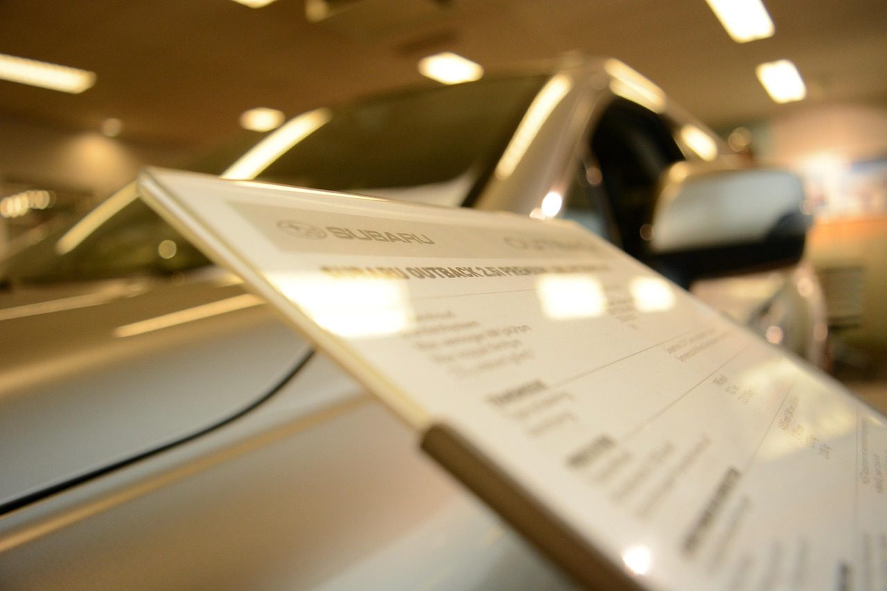 A car dealership showroom with new vehicles for sale
