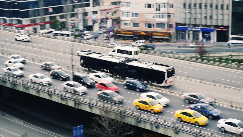 Cars, taxis and a bus on a city expressway overpass