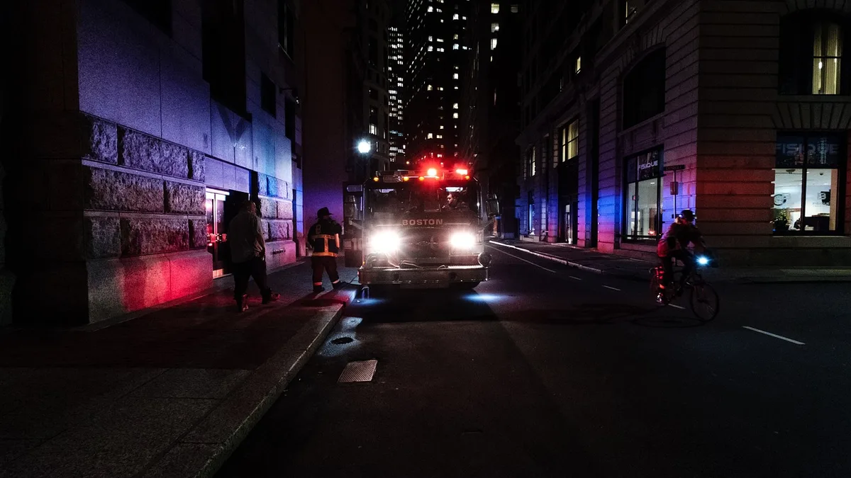 Police lights at night during a vehicle pursuit.