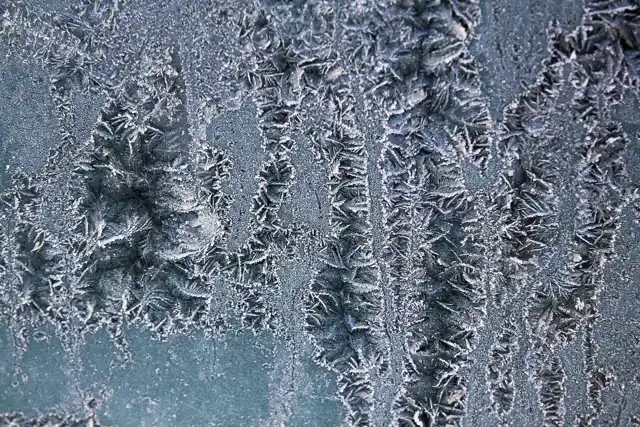 Close-up of frost crystals on a glass surface