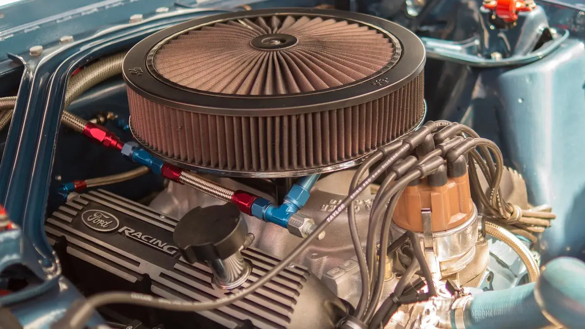 Close-up of a car engine bay showing the radiator and cooling system hoses