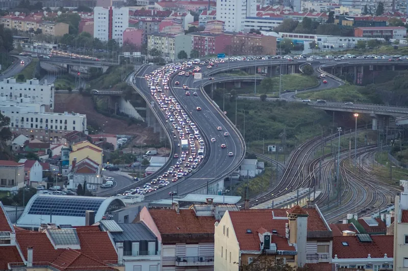 Slow traffic on a multi-lane road above a city