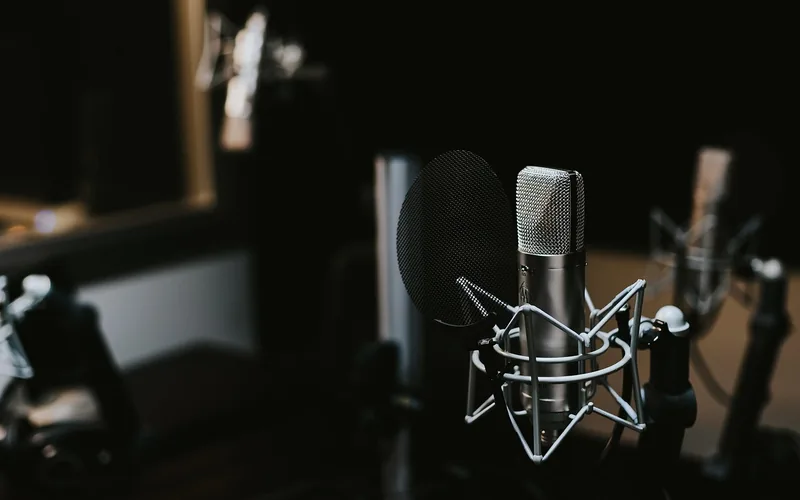 A voice actor’s microphone setup in a professional recording studio