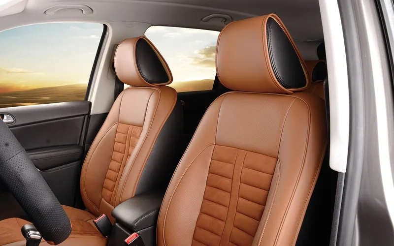 Front car seats showing the center console armrest area from a side angle Front car seats showing the center console armrest area from a side angle