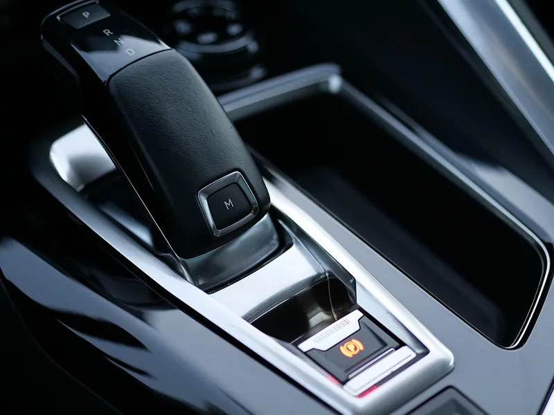 Automatic transmission shift lever with the P, R, N and D positions marked on the console