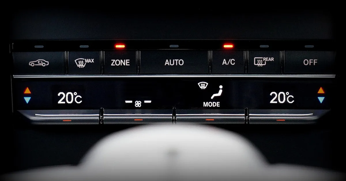 Car climate control panel with the recirculation button at the far left
