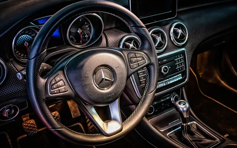 Close-up view of a car dashboard's vinyl and plastic surfaces, the areas most affected by UV exposure and where a protectant is applied