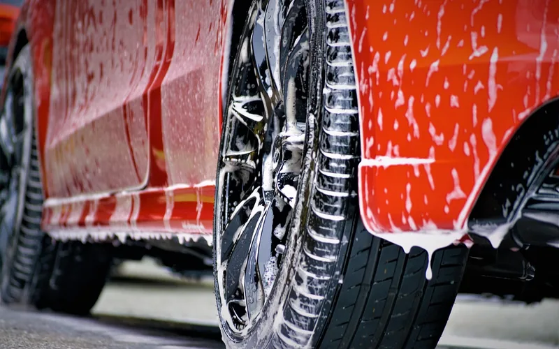 car being foam washed before a diluted isopropyl alcohol panel wipe