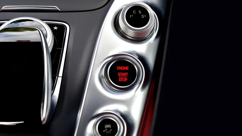 Engine start stop button on a car center console