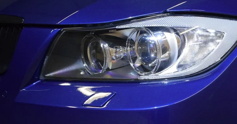 Glossy blue clear coat paint on a car front fender