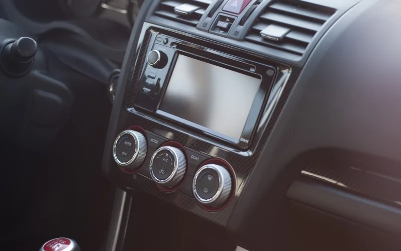 Car stereo dashboard controls and touchscreen head unit in a modern vehicle Car stereo dashboard controls and touchscreen head unit in a modern vehicle