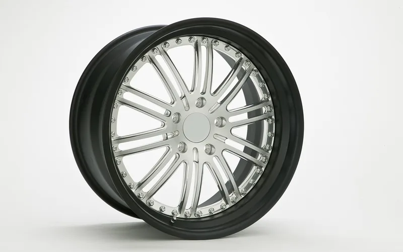 close-up of a car wheel and tire, relevant to ramp tread width and clearance