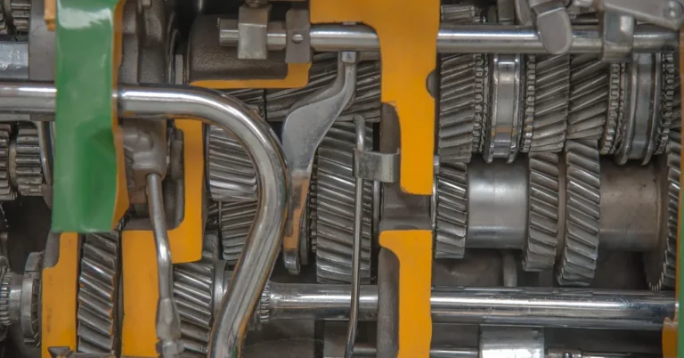 Cutaway of a gearbox showing helical gears, shafts and shift rods