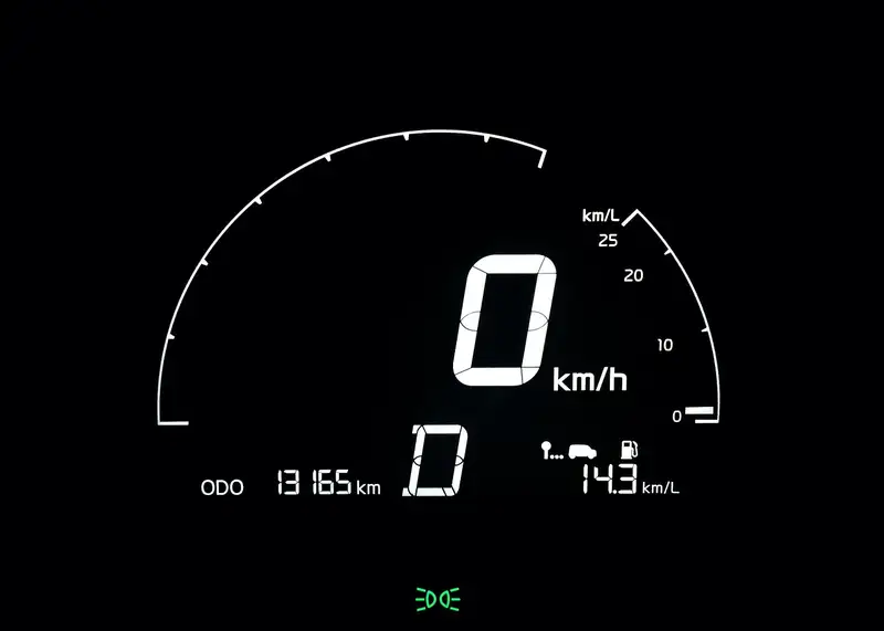 Digital instrument cluster showing speed and a fuel economy readout in km per liter
