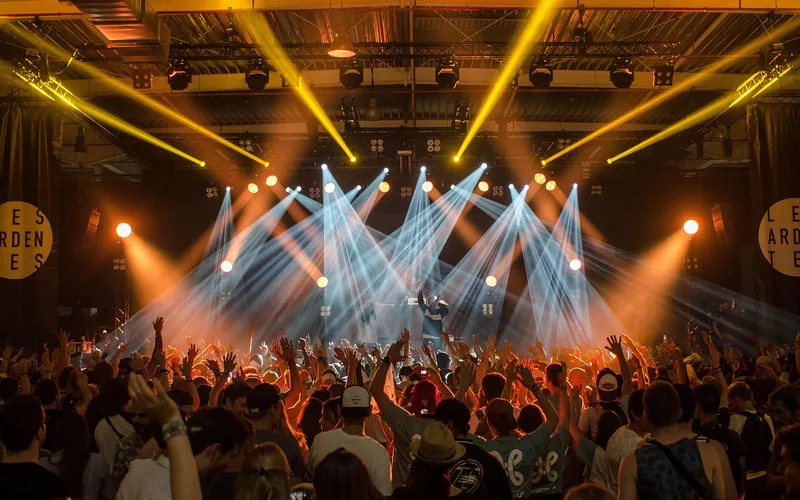 Fast Car returned to the charts after a live 2024 awards-show performance Concert crowd and stage lights during a live music awards performance