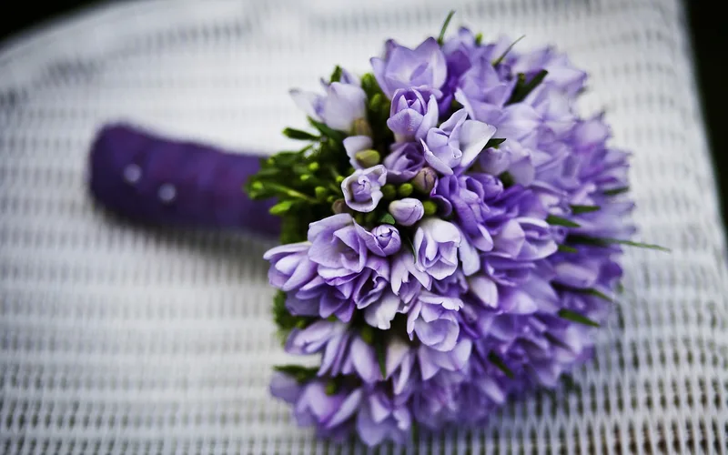 Fresh flowers secured in a stable bucket container to prevent tipping during a car ride